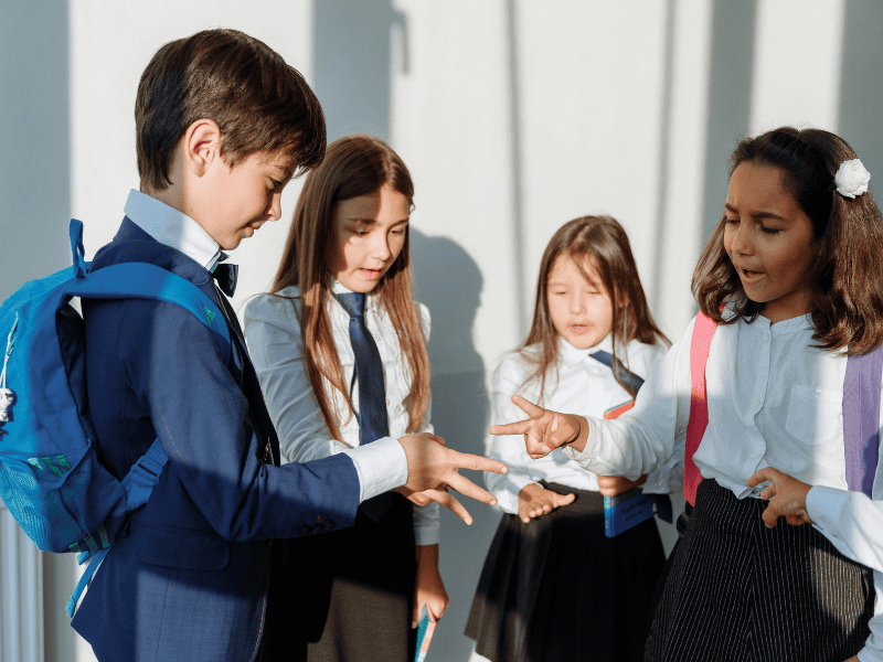 Teacher with students smiling